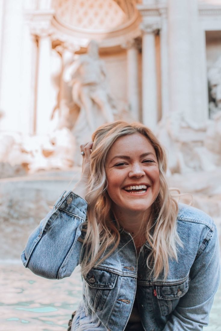 A young blonde woman smiling
