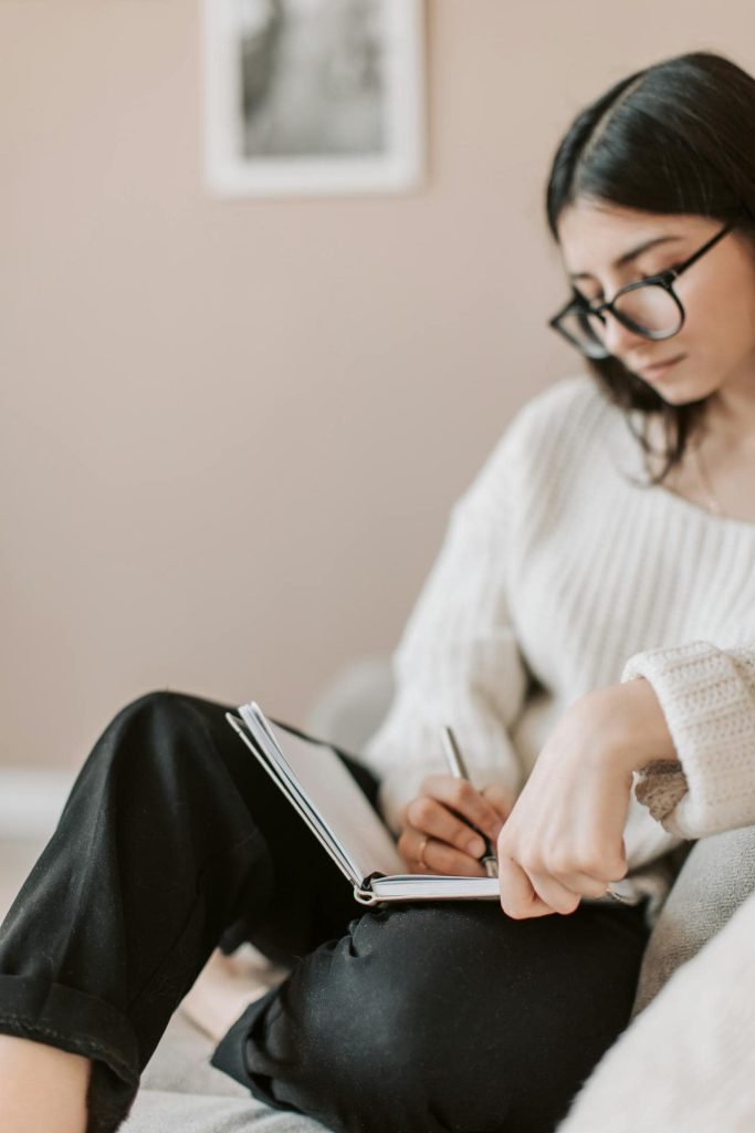 A woman writing in her journal