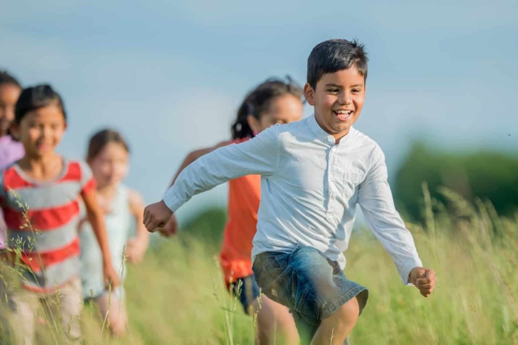 Kids running in a field