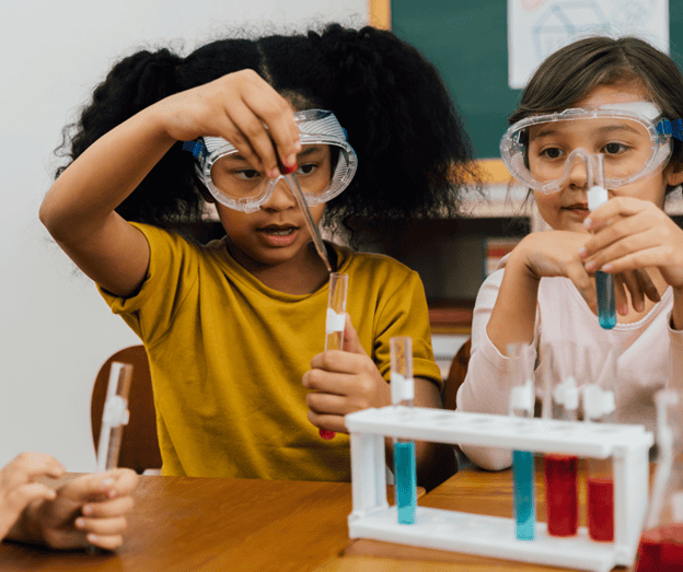 Two kids performing a science experiment