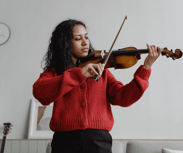 A young Indian teenager playing the violin