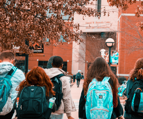 A group of teens headed into a college building