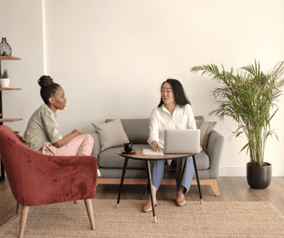 An African American woman speaking with her mental health therapist